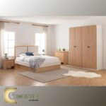 غرفة نوم شبابي مودرن مكونة من سرير ودولاب وتسريحة بتصميم انسيابي وأنيق.